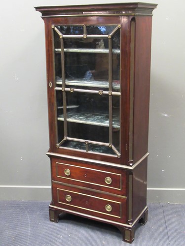 Lot 634 - An Empire style mahogany and brass bound...