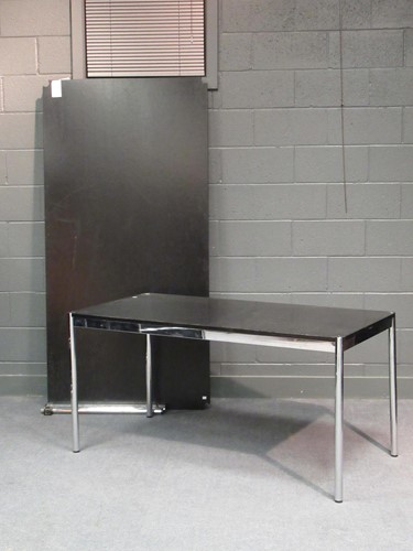 Lot 695 - A USM Haller black linoleum and tubular chrome...