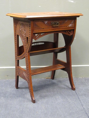 Lot 683 - An Arts & Crafts carved walnut table with...