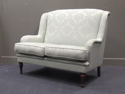 Lot 646 - A "Wesley Barrel" two seater sofa 109cm high...