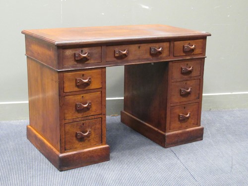 Lot 664 - A late Victorian walnut twin pedestal desk...