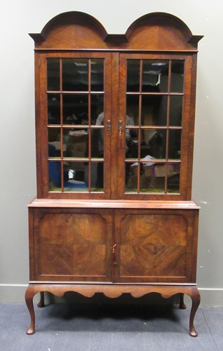Lot 555 - An Edwardian walnut double dome top glazed...