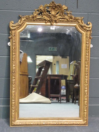 Lot 754 - A 19th century gilt wood wall mirror of arched...