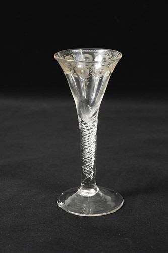 Lot 443 - A rare George II trick wine glass, circa 1740