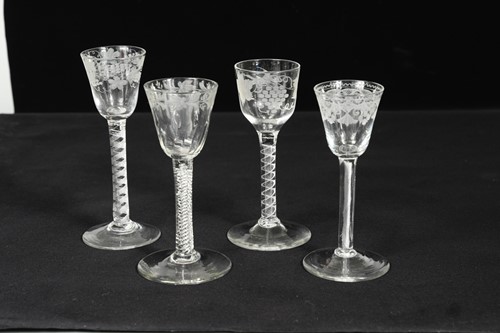 Lot 456 - Four mid 18th century engraved wine glasses