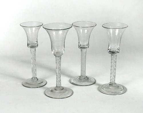 Lot 452 - Four George II air twist wine glasses, circa 1750