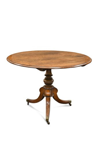 Lot 827 - A figured oak circular centre table, early 19th century