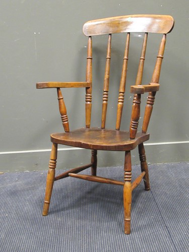 Lot 549 - A beechwood stick back kitchen armchair