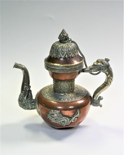 Lot 154 - A Tibetan copper and silver plated butter- tea pot, late 19th/early 20th century