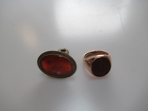 Lot 307 - A cornelian intaglio signet ring with a worn...
