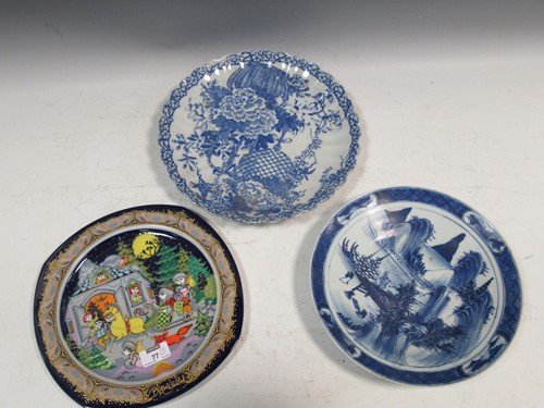 Lot 77 - Two blue and white plates depicting floral and...