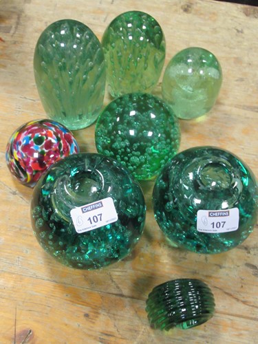 Lot 107 - Six Victorian green glass dumps