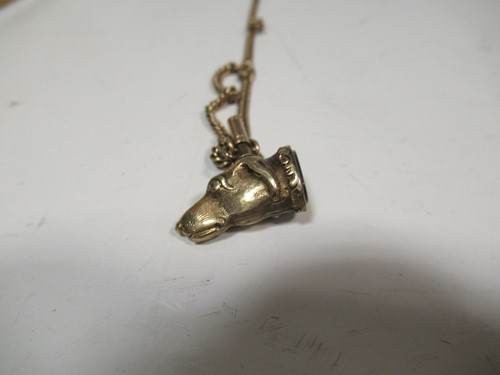Lot 327 - A dog head fob seal and chain