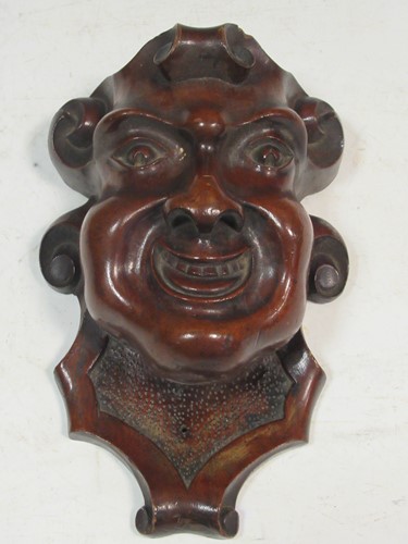 Lot 192 - A carved wooden head of a man,...