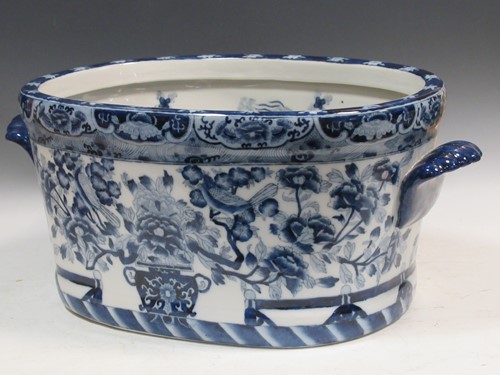 Lot 197 - A 19th century two-handled blue and white foot...