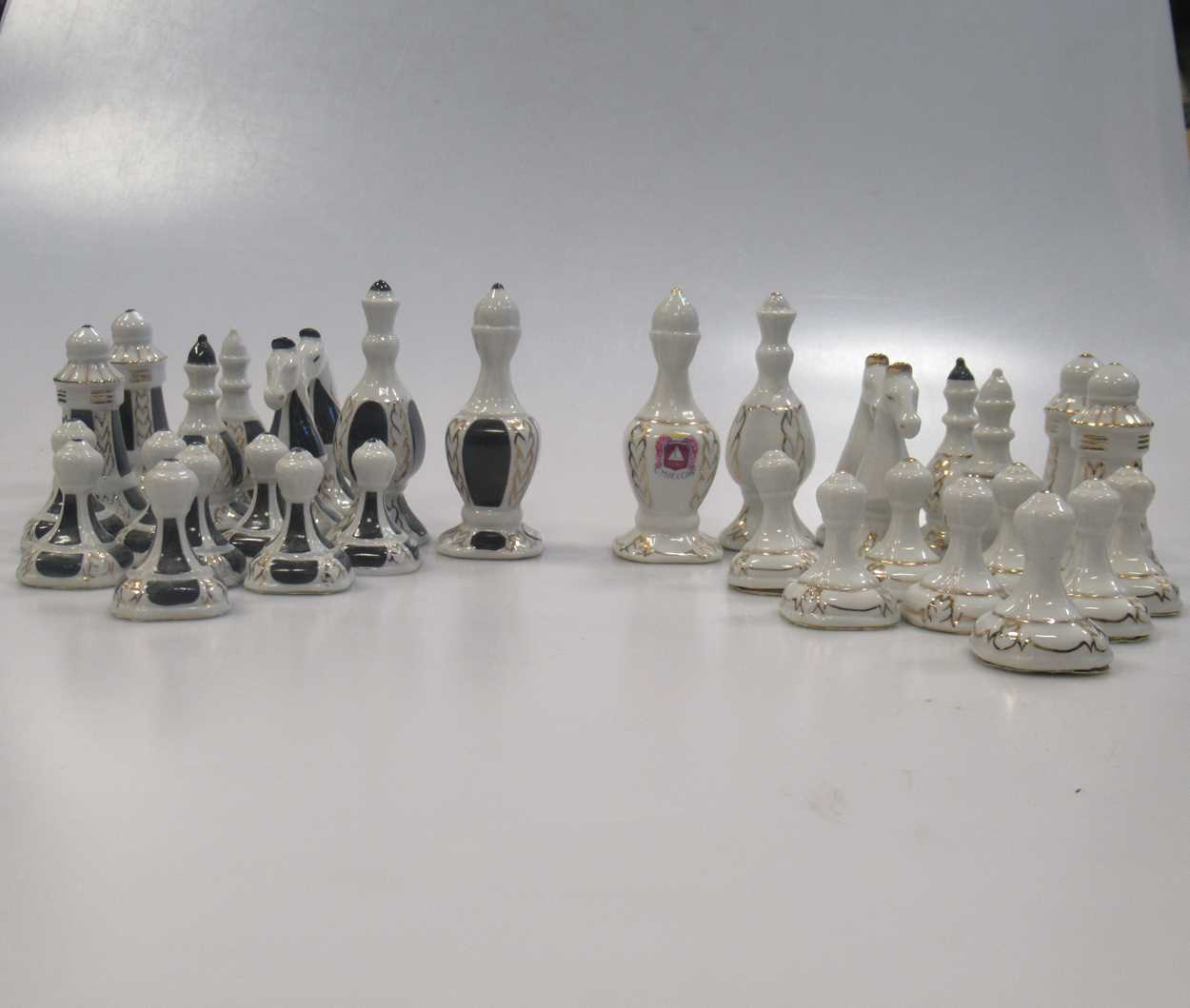 Lot 203 - A 20th French Limoges porcelain chess set, the...