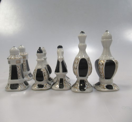 Lot 203 - A 20th French Limoges porcelain chess set, the...