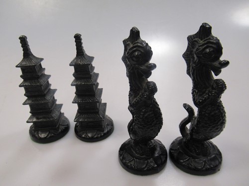 Lot 209 - A South East Asian carved hardwood chess set,...