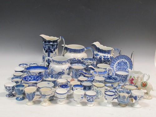 Lot 242 - A collection of English ceramic egg cups, to...