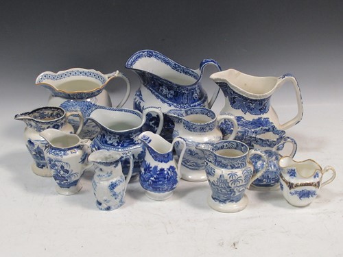 Lot 247 - A collection of blue and white jugs to include...