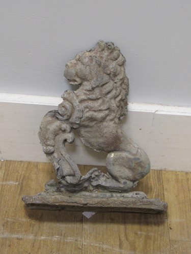 Lot 724 - A 19th century lead doorstop of a rampant lion...