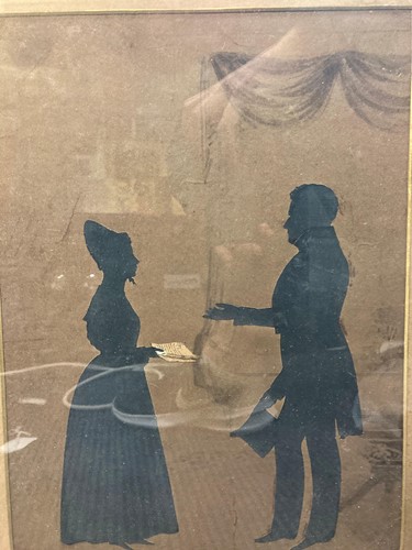 Lot 387 - 19th century silhouette of a courting couple,...