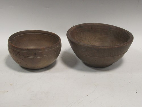 Lot 148 - Two treen bowls, largest 9cm high and 20cm...