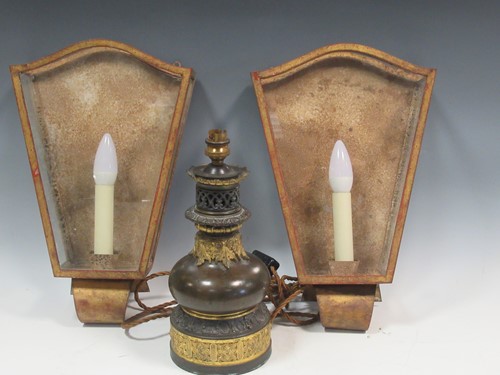 Lot 37 - A pair of patinated and gilt wall lights...