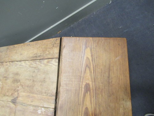 Lot 572 - A pine drop leaf table with two drawers on...
