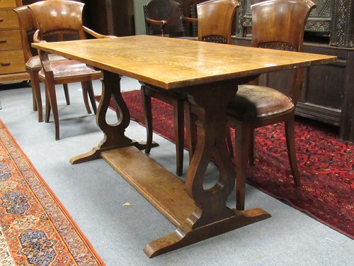 Lot 597 - An oak trestle table 73 x 152 x 75rcm