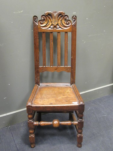 Lot 491 - Early 18th century oak scroll crested side chair