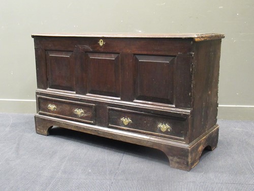 Lot 555 - An 18th century oak mule chest, the three...