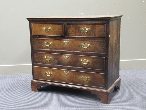 Lot 440 - George III oak chest of two short and three...