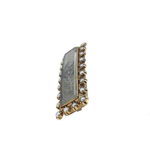 Lot 31 - A 19th century hairwork and pearl memorial brooch