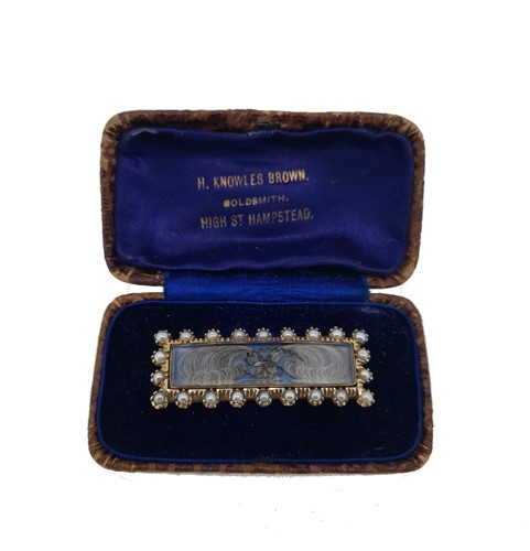 Lot 31 - A 19th century hairwork and pearl memorial brooch