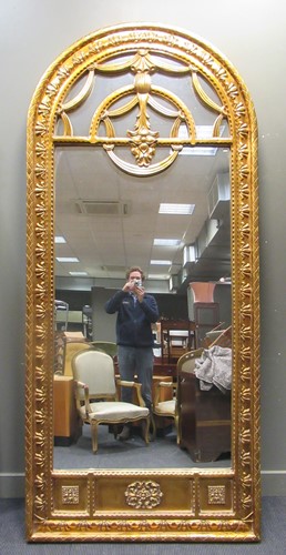 Lot 531 - A large gilt wall mirror with arch top, 270 x...