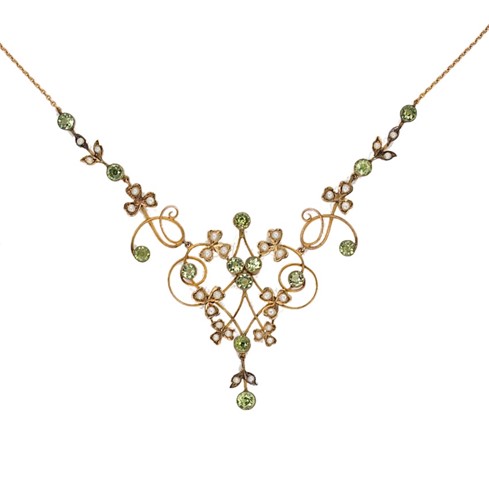 Lot 74 - An Edwardian peridot and split pearl necklace