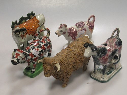 Lot 197 - A group of three 19th century cow creamers,...