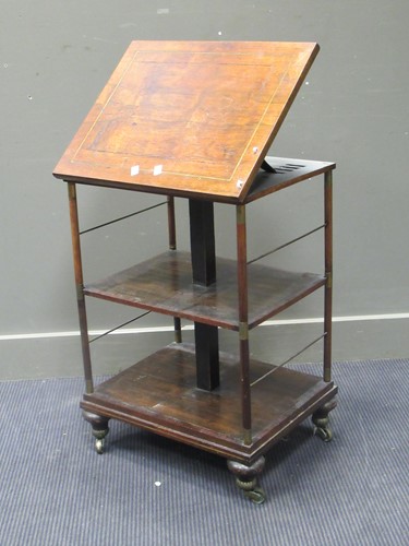 Lot 494 - A Regency rosewood and brass inlaid three tier...
