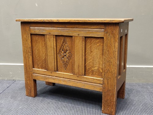 Lot 732 - An Arts & Crafts oak panelled coffer of...