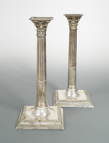 Lot 477 - A pair of George II cast silver candlesticks