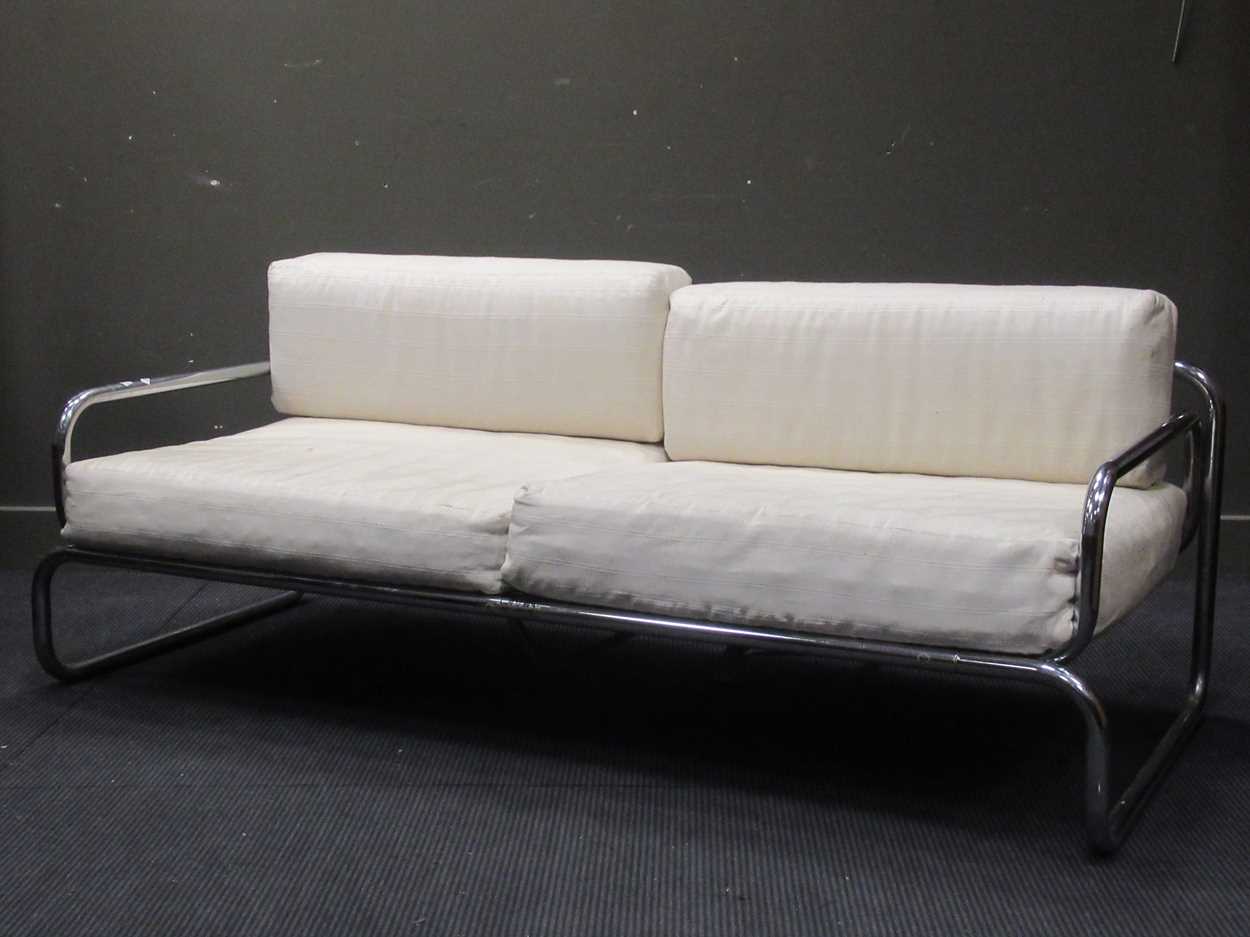 Lot 632 - Chrome tubular sofa with white striped...