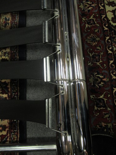 Lot 632 - Chrome tubular sofa with white striped...