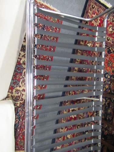 Lot 632 - Chrome tubular sofa with white striped...