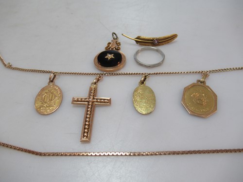 Lot 183 - four pendants tested as 18ct gold attached to...