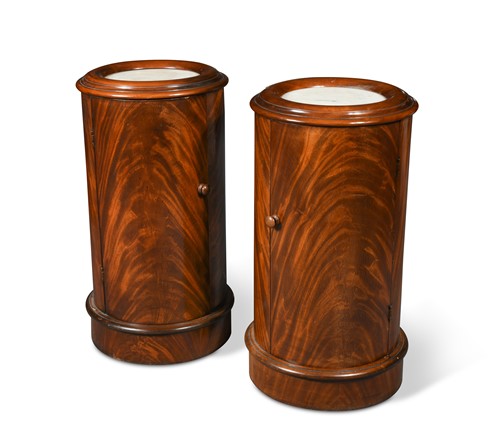 Lot 431 - A pair of Victorian figured mahogany cylindrical pot cupboards