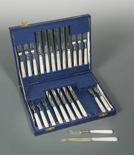 Lot 575 - A cased set of 12 pairs of George VI silver fruit eaters