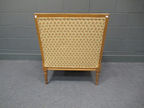Lot 556 - A French style reproduction easy armchair, and...