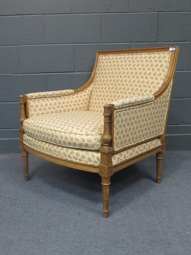 Lot 556 - A French style reproduction easy armchair, and...