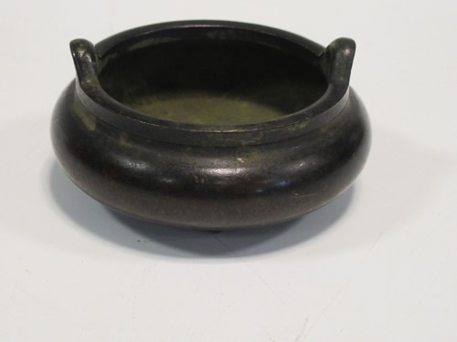 Lot 109 - A Chinese bronze censor with four character...